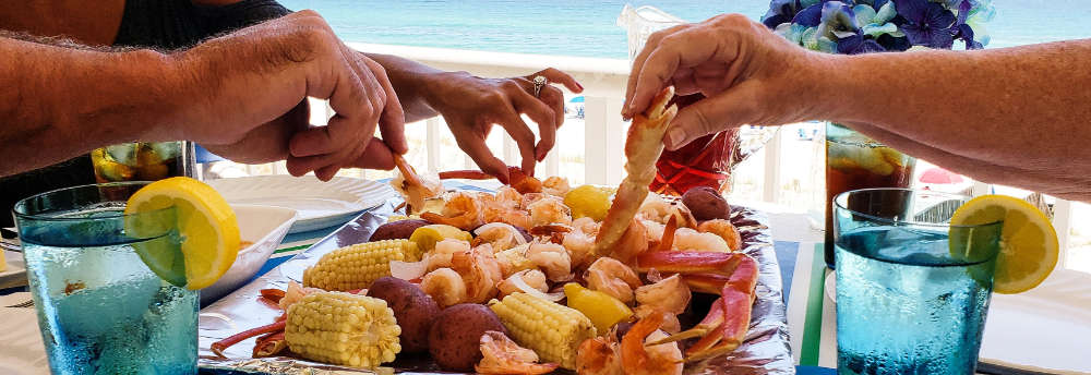 family enjoying a seafood boil from JJ Crab House Ann Arbor